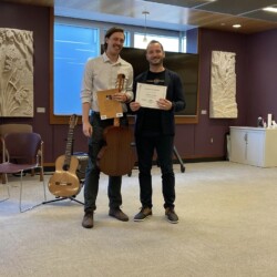 guitar level classical guitar teacher and guitar student holding a certificate
